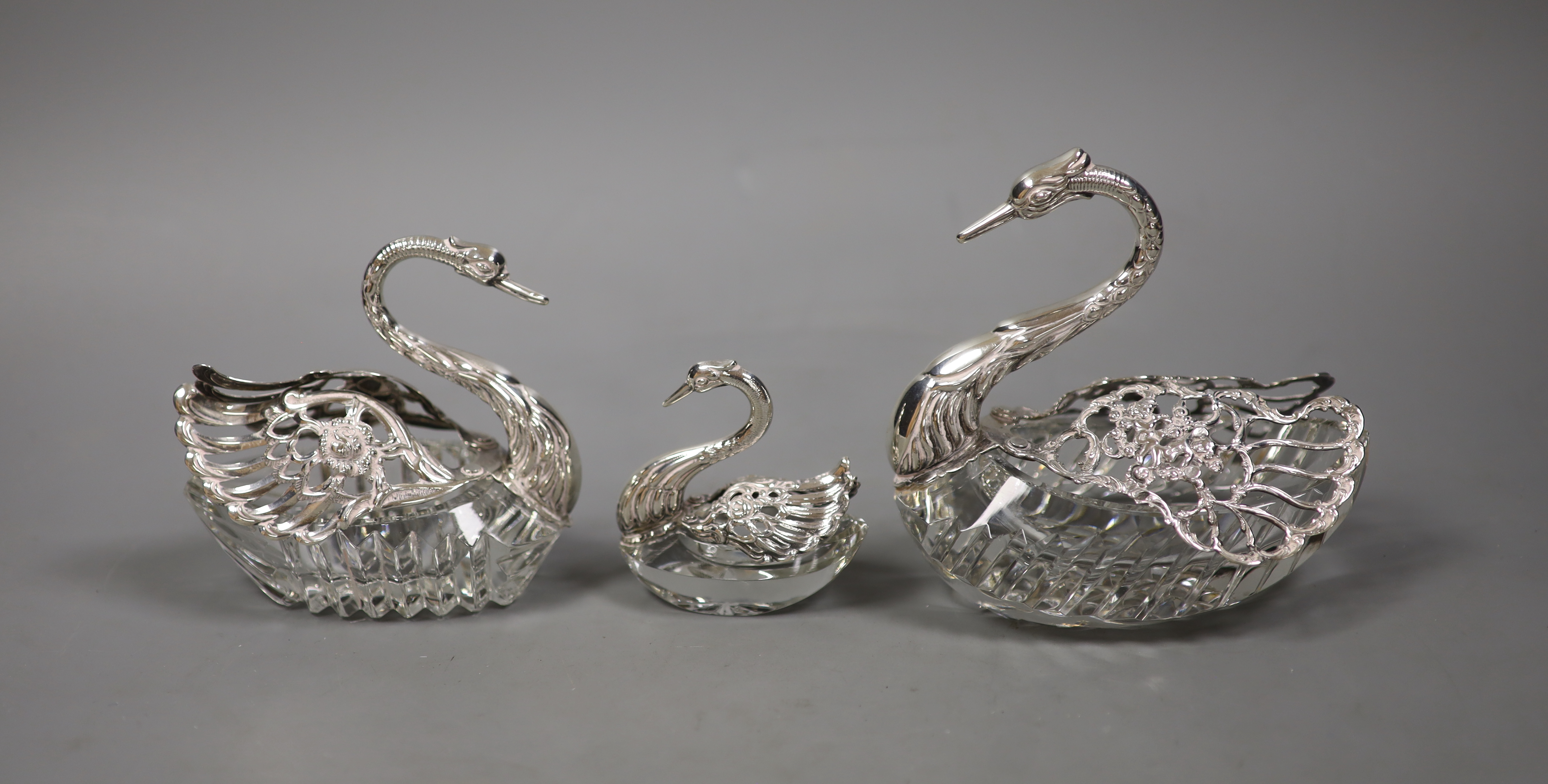 A set of three graduated silver-mounted cut glass 'swan' bon bon dishes